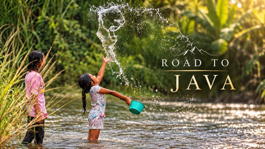 Two children play in a tropical river in Java, Indonesia, as one girl throws water into the air, capturing a joyful moment of everyday life in the Road to Java documentary.