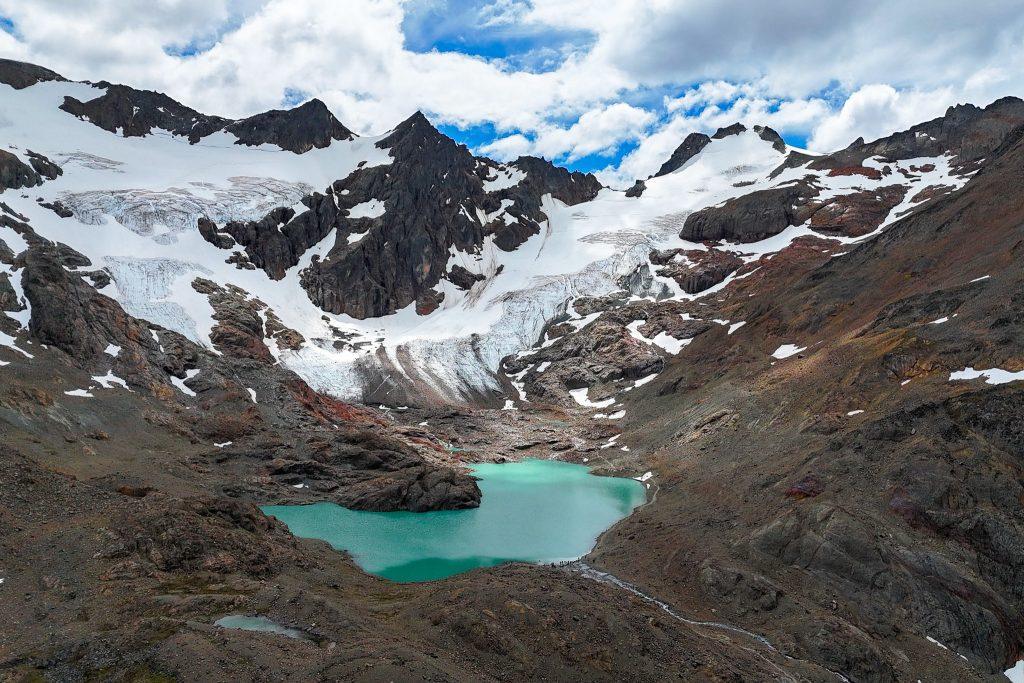View of a retreating glacier with a turquoise lagoon in the high mountains, Andean Patagonia.