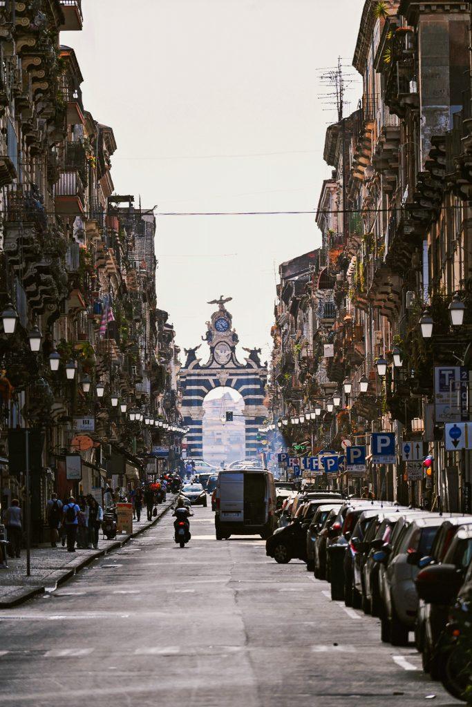 View of the Porta Garibaldi, a monumental arch in Catania built from lava stone.