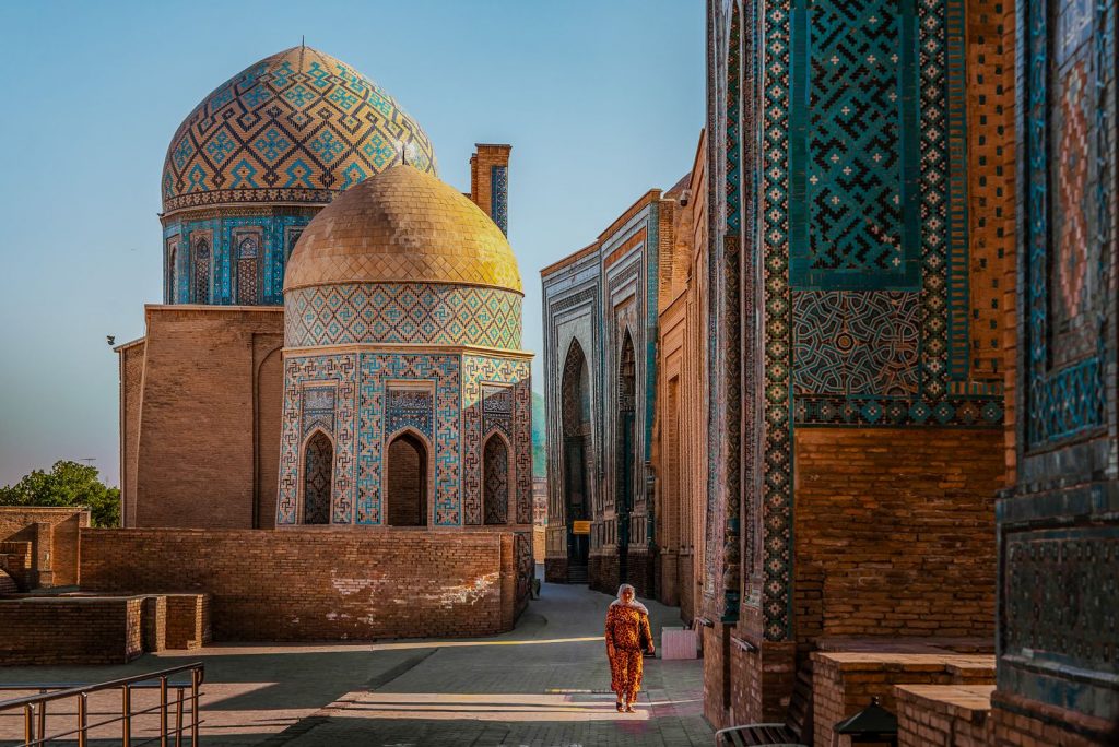 Mausoleums lined up along the Shah-i-Zinda corridor in Samarkand, with domes and glazed brick facades