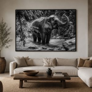 mockup of the An Asian elephant bathing in a forest river in Thailand while its mahout watches nearby.