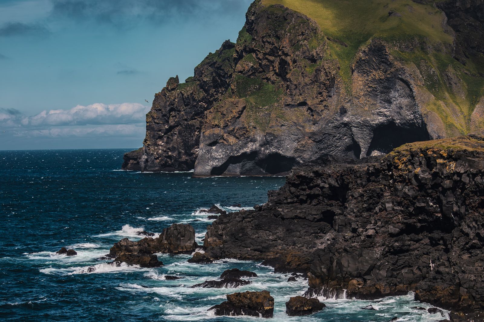 Basalt sea cliffs on the southern coast of Iceland