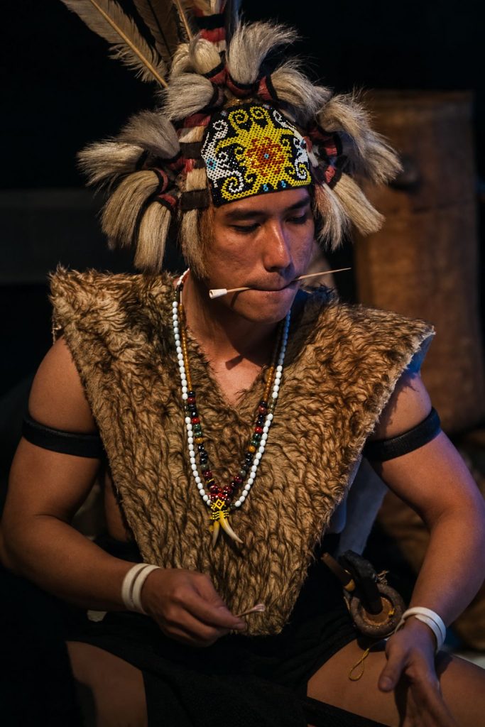 A man wearing traditional attire during a cultural gathering in Sarawak, Borneo.