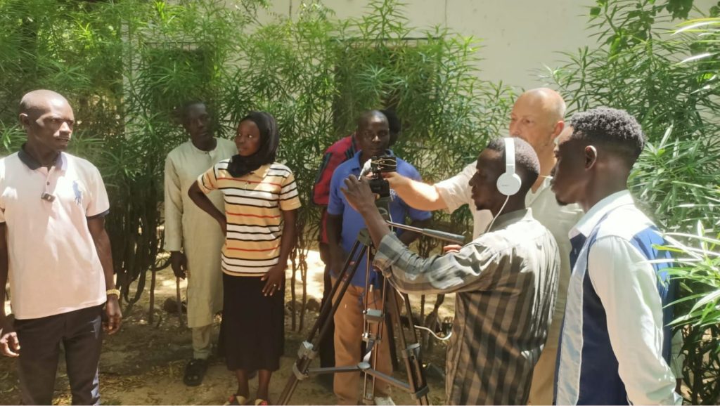 A team documenting an language through field interviews.